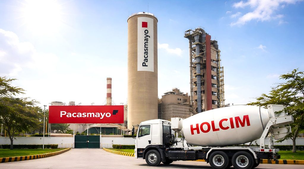 Planta industrial de Cementos Pacasmayo con infraestructura cementera y camión mezclador en primer plano.